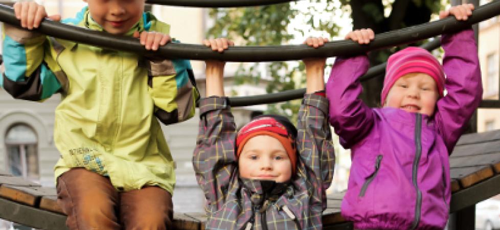 three children playing at the playgound