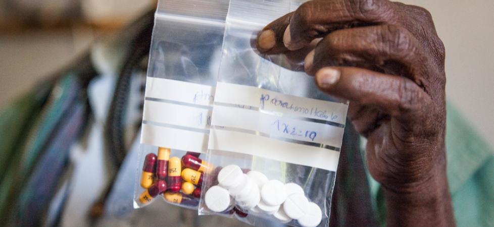 man holding a medicine bag