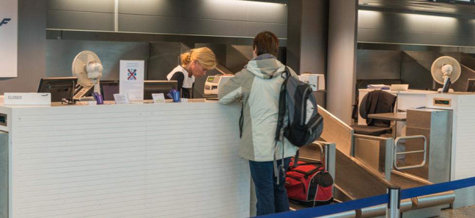 man at checkin counter